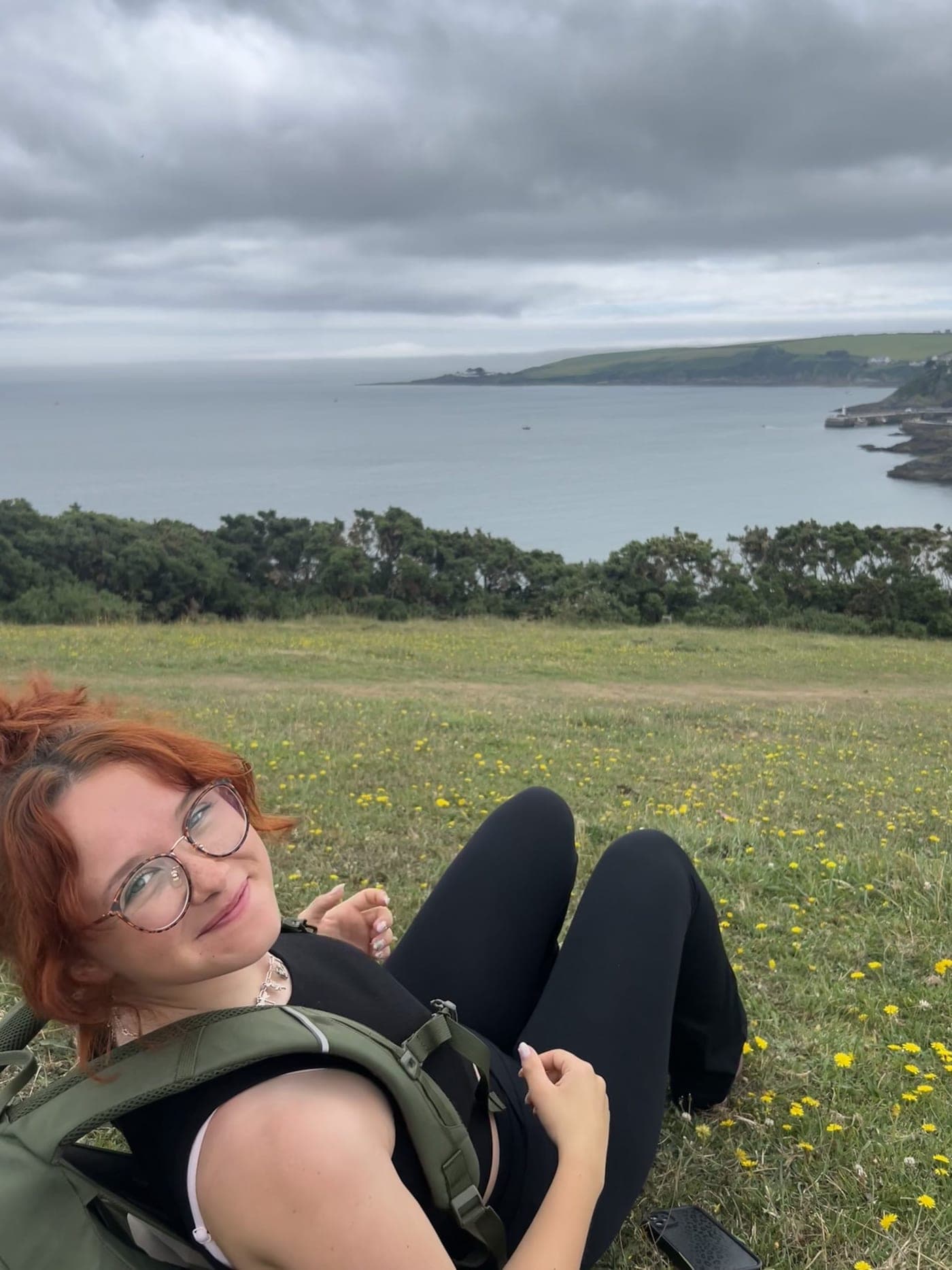 Chloe on a coastal hike with her rucksack